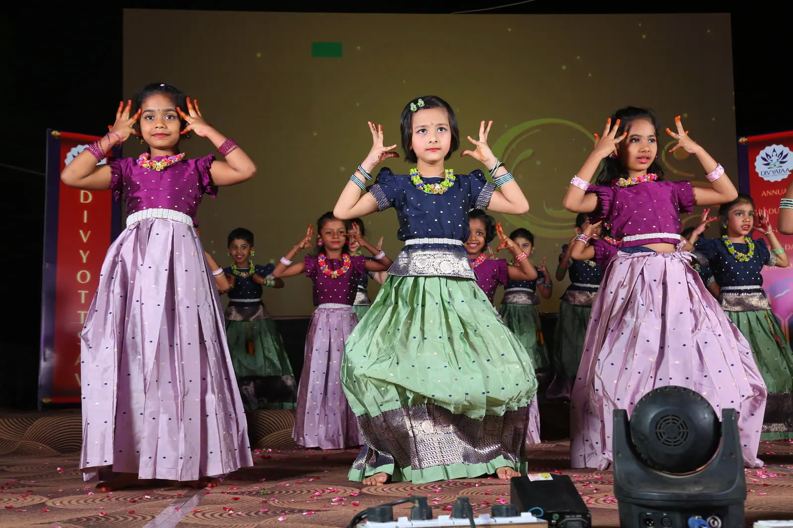 Girls in silk skirts performing a classical dance